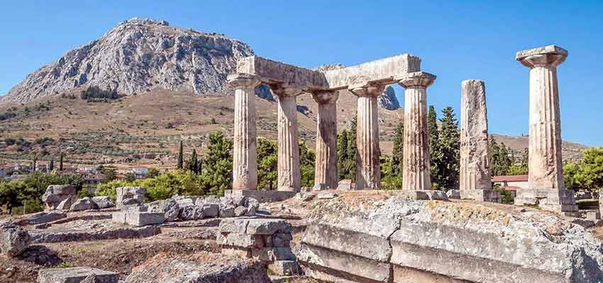 The Temple of Apollo in Ancient Corinth with Acrocorinth in the background