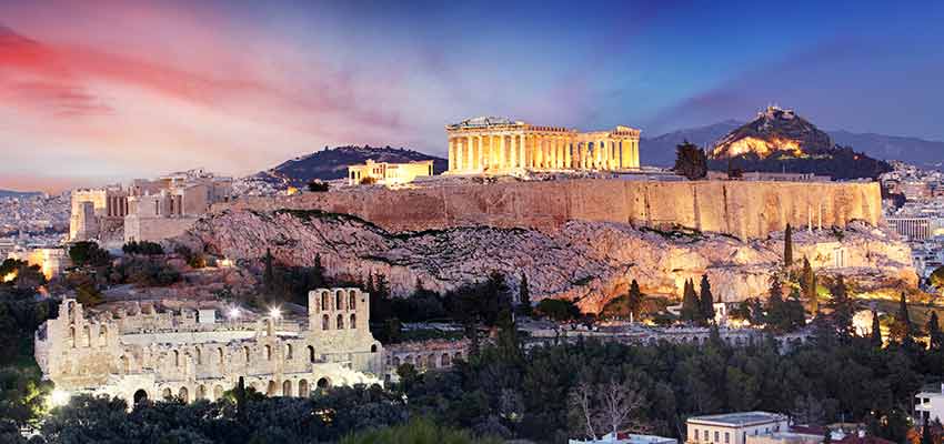 The Parthenon lit up at night on top of the Acropolis