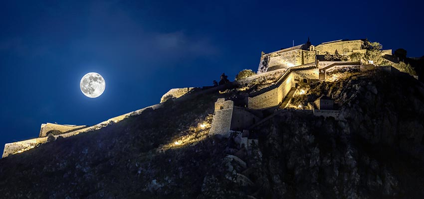Castle Palamidi lit up at night in Nafplio