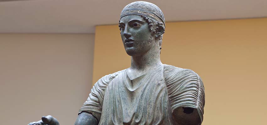 The famous statue of the charioteer at the Delphi museum